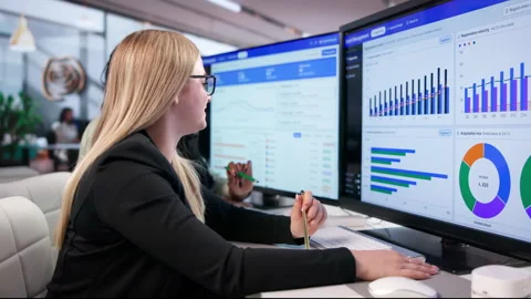 Event Manager Reviews Conference Dashboard On Desktop, Planning Sessions Stock Footage 345324984