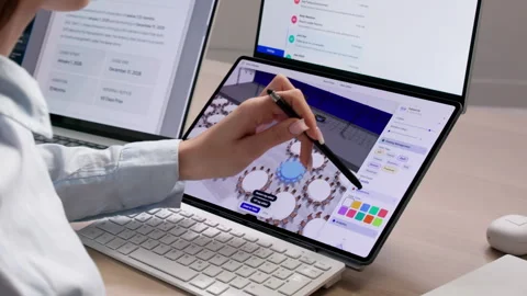 Event Planner Works Diligently On Laptop Organizing Tables Stock Footage 334534969