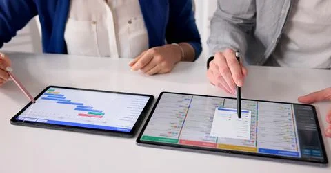 Event Planning Progress. Project Manager Analyzes Schedule And Updates Gantt  Stock Photos