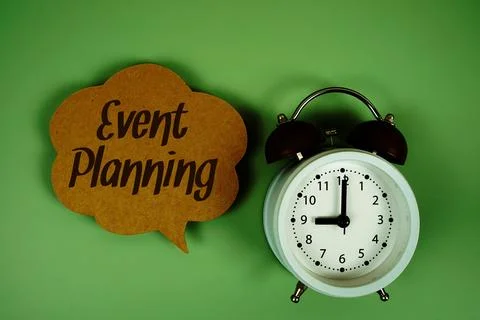 Event Planning text on speech bubble with alarm clock on green background Stock Photos