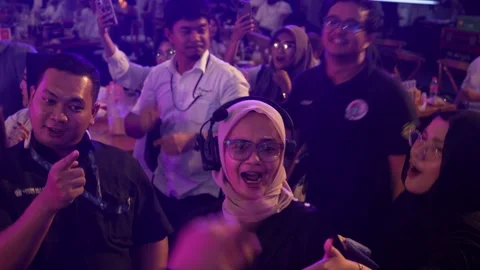 Event staff having fun and dancing together with a walkie talkie Vidéo 331664414