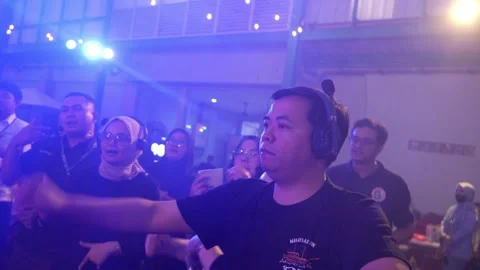 Event staff with intercoms sharing a dance on the floor 動画素材 331661173