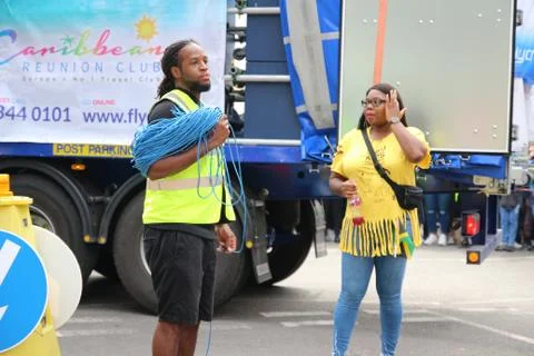 The event workers worries while standing next to truck Foto stock