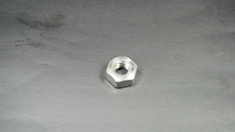 Everbilt Zinc plated hexagonal shape nut with clear background Stock Photos
