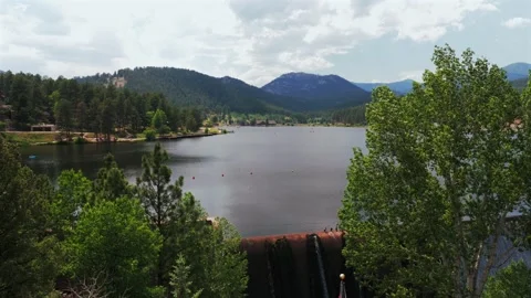 Evergreen Lake dam structure American flag nature landscape downtown Evergreen Stock Footage 340964012