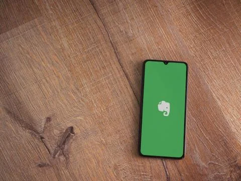 Evernote app launch screen with logo on the display of a black mobile smartph Stock Photos