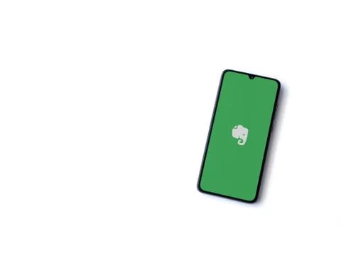 Evernote app launch screen with logo on the display of a black mobile smartph Stock Photos