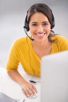 Every client matters. a young customer service representative wearing a headset 스톡 사진