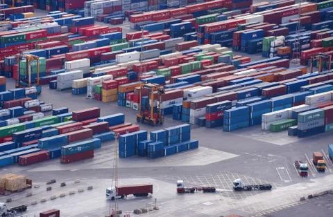 Every day thousands of containers from all over the world arrive at Port of B Stock Photos
