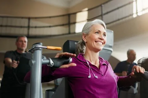 Every push and pull helps me age backwards. Portrait of a happy senior woman Stock Photos