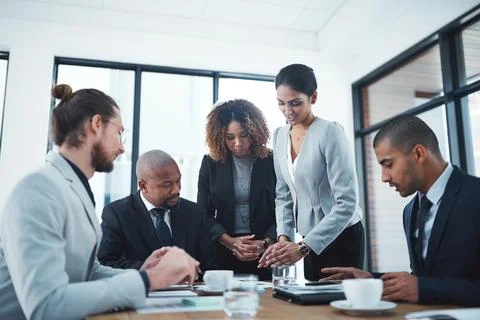 Every team member is fully committed. a group of businesspeople having a Stock Photos