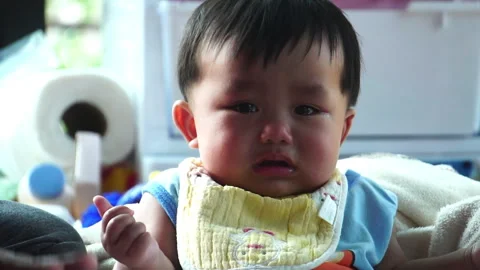 Every tear is a step in development, showing the raw and honest growth of a chil Stock Footage 302813144