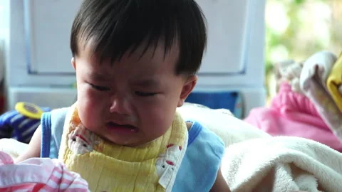 Every tear is a step in development, showing the raw and honest growth of a chil Stock Footage 302814697