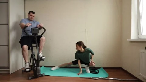 Everyday people performing a cardio session indoors on a wooden floor, surr.. Video stock 308225535