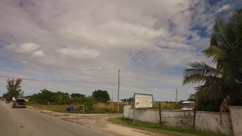 Everyday Road Scene Driving Through Eight Mile Rock, Bahamas Stock Footage 99913412