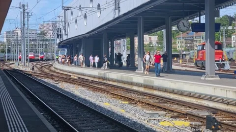Everyday scene at Bern train station, Switzerland, as commuters and travelers Stock Footage 342754471