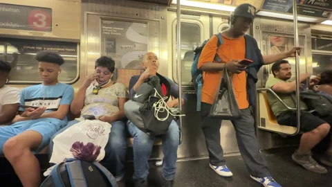 Everyday Scene Inside NYC Subway with Man Listening to Music Stock Footage 312020622