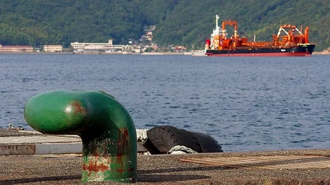Everyday Setouchi scenery with bollard and cargo crane vessel, 4K Video stock 342496945