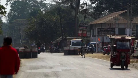 Everyday Traffic and Local Shops Along Town Road in Dibrugarh Stock Footage 328822424