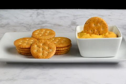 Everything  crackers stacked  with cheese dip Stock Photos