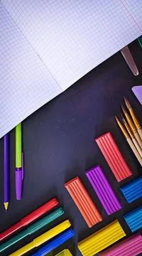 Everything for creativity, various stationery on a black background of a chalk Stock Photos