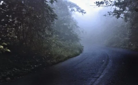 Everything started to get dark and the road became cloudy Stock Photos