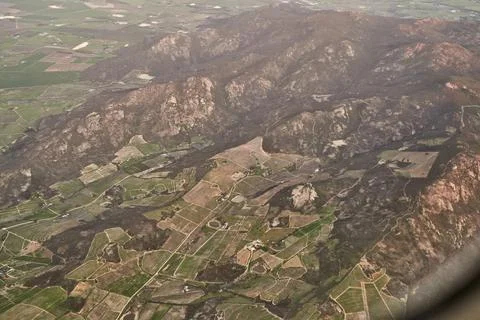 Everything is tiny from up here. High angle shot of the views from an airplan Foto stock