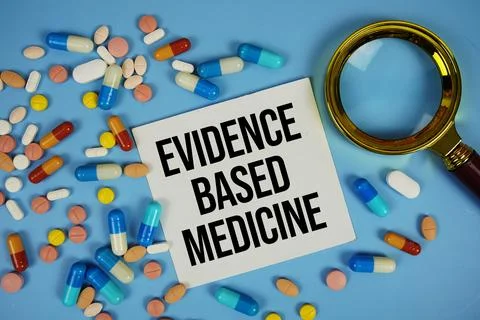 Evidence Based Medicine text on sticky note paper with Medicine and Maginfy.. Stock Photos