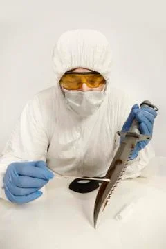 Evidence of cold weapon in protective plastic tube - unpacking Stock Photos