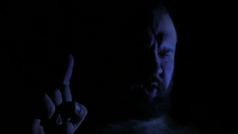 Evil and angry bald man speaking in darkness. 4K UHD 動画素材 73677585