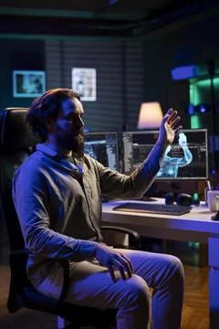 Evil artificial intelligence manipulating IT professional, threatening humanity Stock Photos