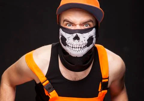 Evil builder. The guy in the orange construction suit. Stock Photos