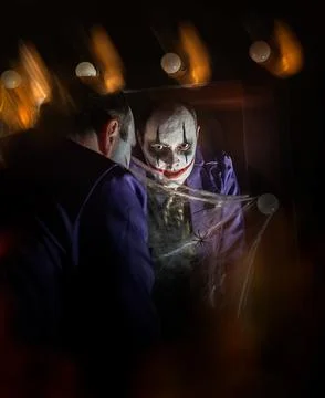Evil Clown in Front of Mirror with Cobwebs Foto stock