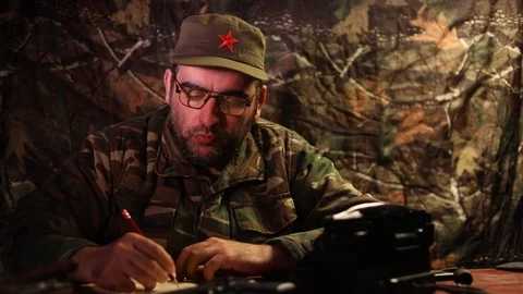 The evil dictator sitting on table 스톡 동영상 104691782