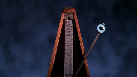 Evil eye attached to metronome Stock Footage 92396990