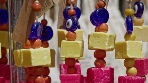 Evil Eye Beads Amulet and Organic Colorful Soap Stock Footage 280180444
