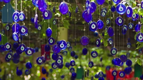 Evil eye beads hanging on branches for decoration purposes Stock Footage 280181651