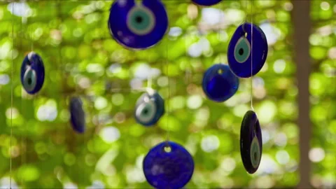 Evil eye beads hanging on branches for decoration purposes Stock Footage 280183684