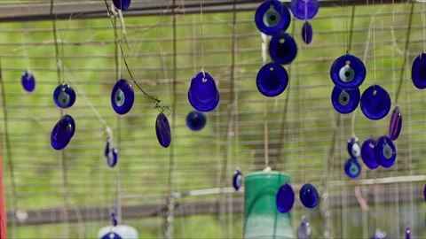 Evil eye beads hanging on branches for decoration purposes Stock Footage 280185079