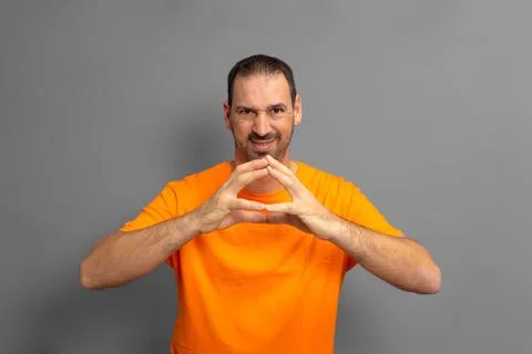 Evil genius, scheming man, making plans, looking cunning and thoughtful, ma.. Stock Photos