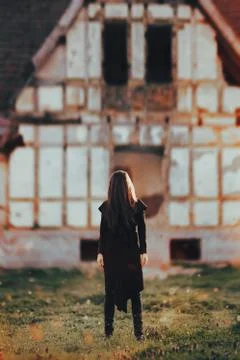 Evil Ghost in Front of a Horror Haunted Abandoned House 스톡 사진