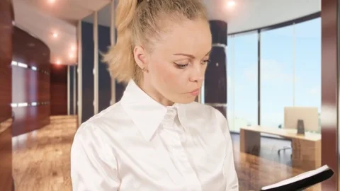 Evil girl looking for a document Stock Footage 78363285