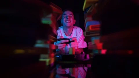 The evil guy plays a retro console. The guy lost the game Stock Footage 126094725