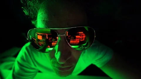 Evil hacker looking at code with sunglasses. Stock Footage 116903888