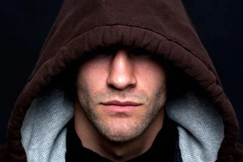 Evil looking hooded man Stock Photos