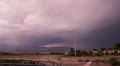 Evil looking thunderstorm over mountain and valley approaches time lapse wide Vídeos en HD