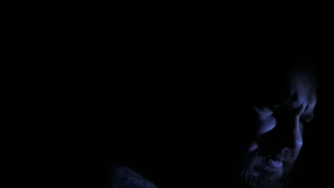 Evil man in the dark closeup. 4K UHD Stock Footage 73677044