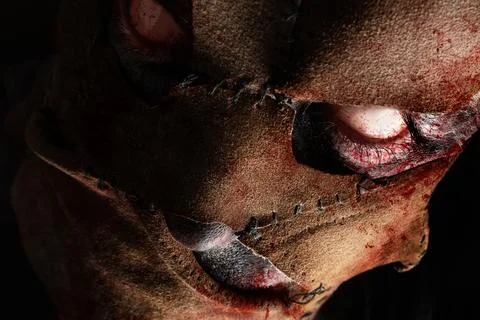 Evil monster murderer face in leather mask. Stock Photos