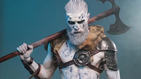 Evil northern warrior with axe on his shoulder in smokey blue background Video stock 147725571