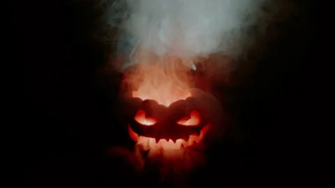 An evil pumpkin looks ahead. Jack is exploding, and engulfed in hellfire. 스톡 동영상 163345799